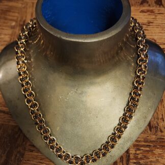 Brass and Titanium Bore Worm Necklace