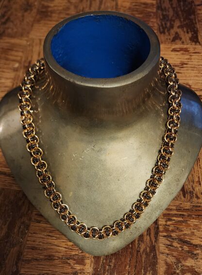 Brass and Titanium Bore Worm Necklace